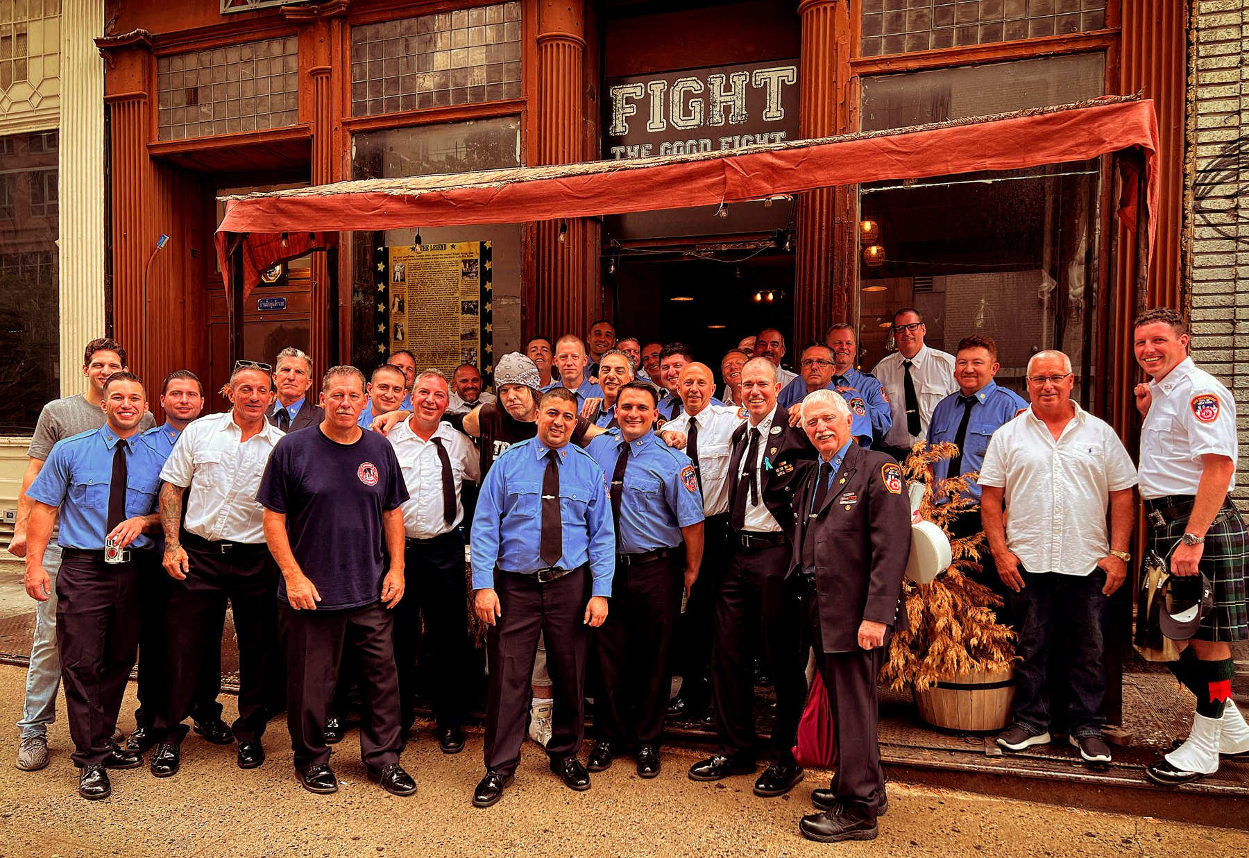 Firemen and neighbors gathered outside Trinity on Duane Street